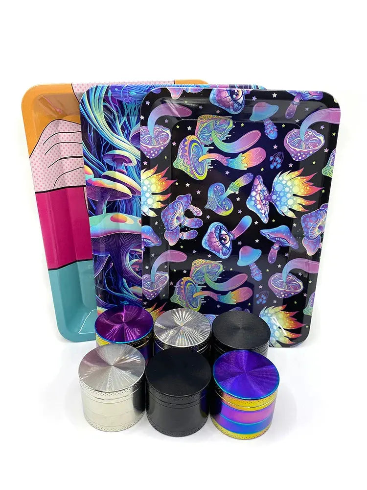 Colorful metal herb grinders and rolling trays set for discreet herb storage and grinding.
