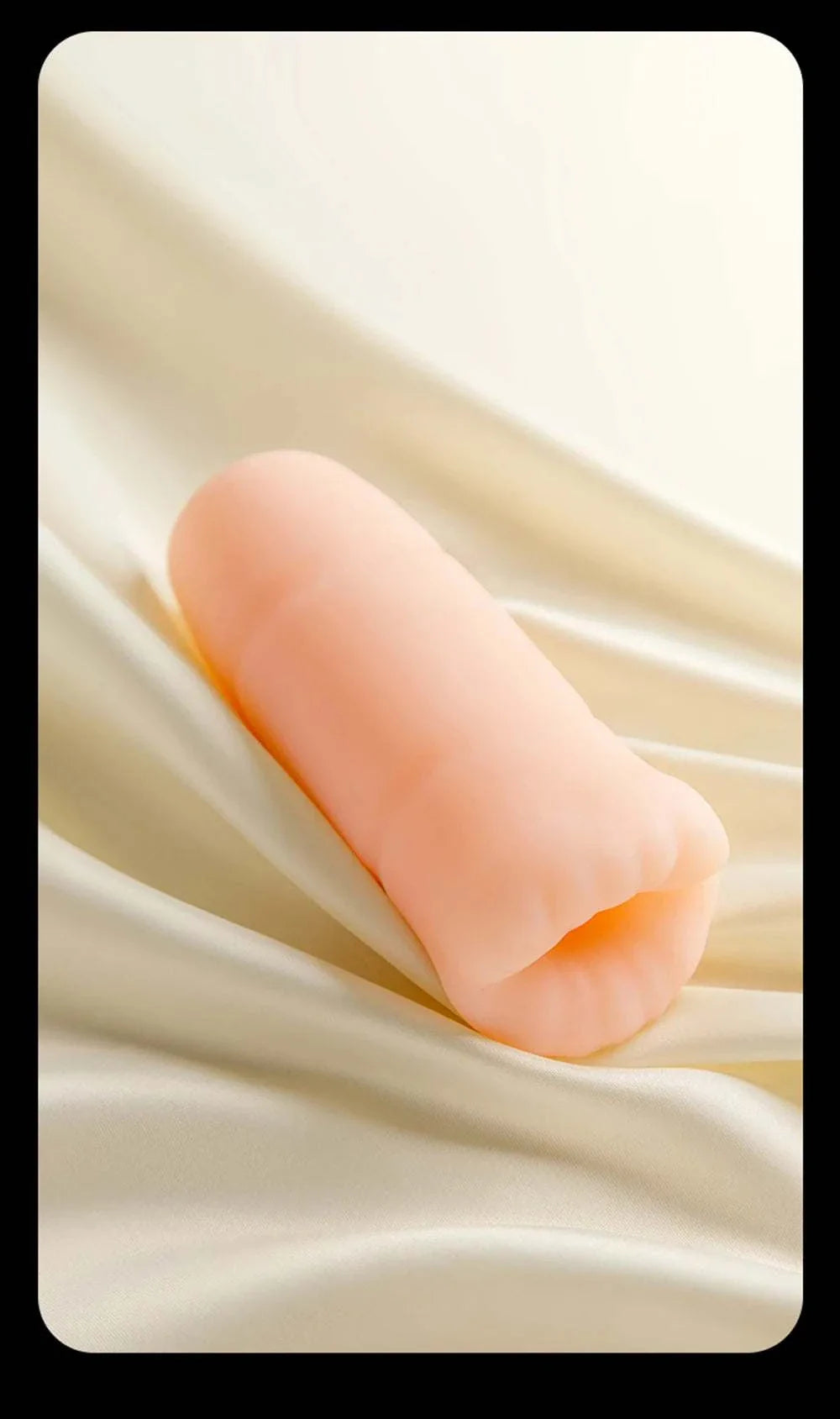 Men's automatic tongue licking oral sex toy on satin background.