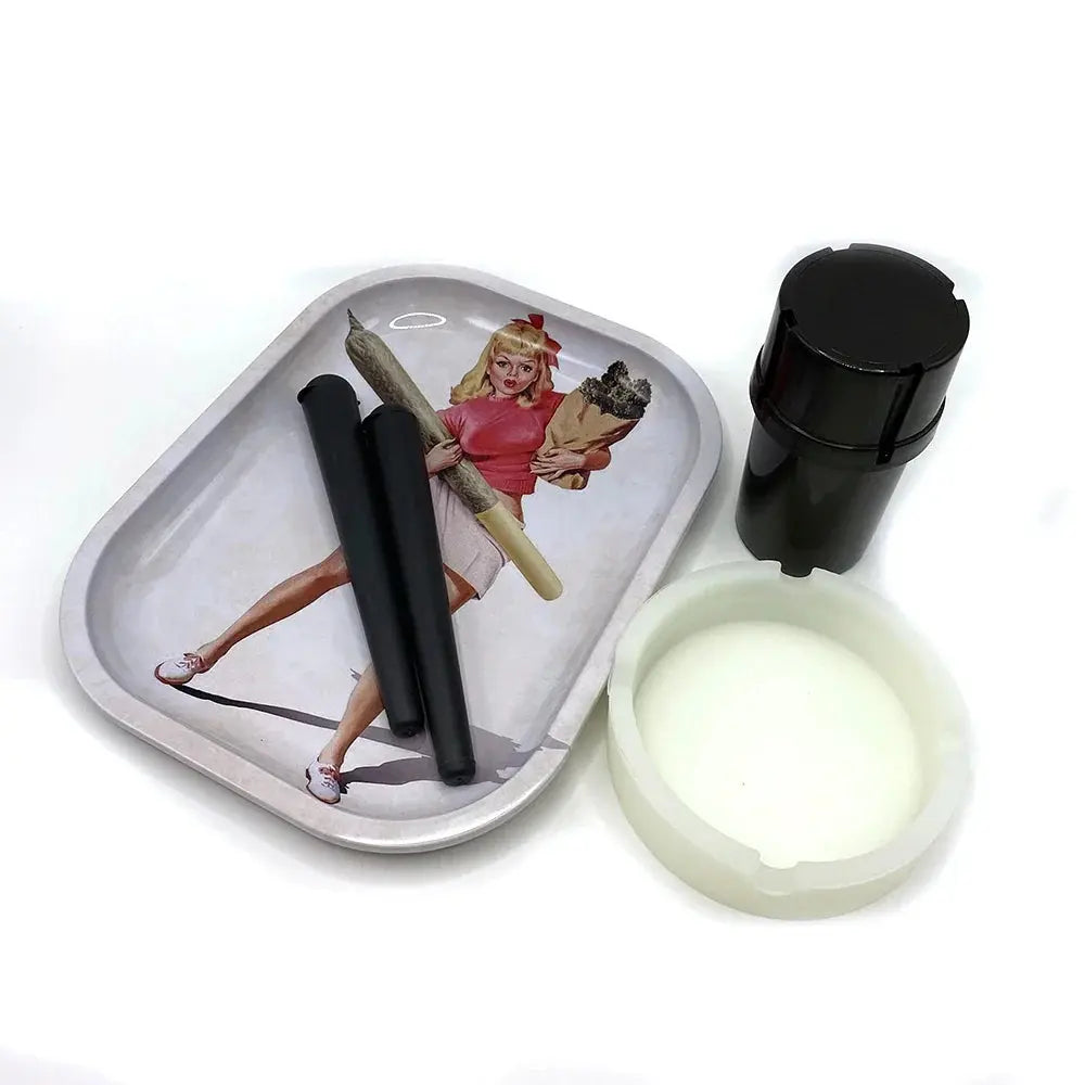 Cigarette plastic herb grinder set with metal rolling tray, silicone ashtray, and storage tube.