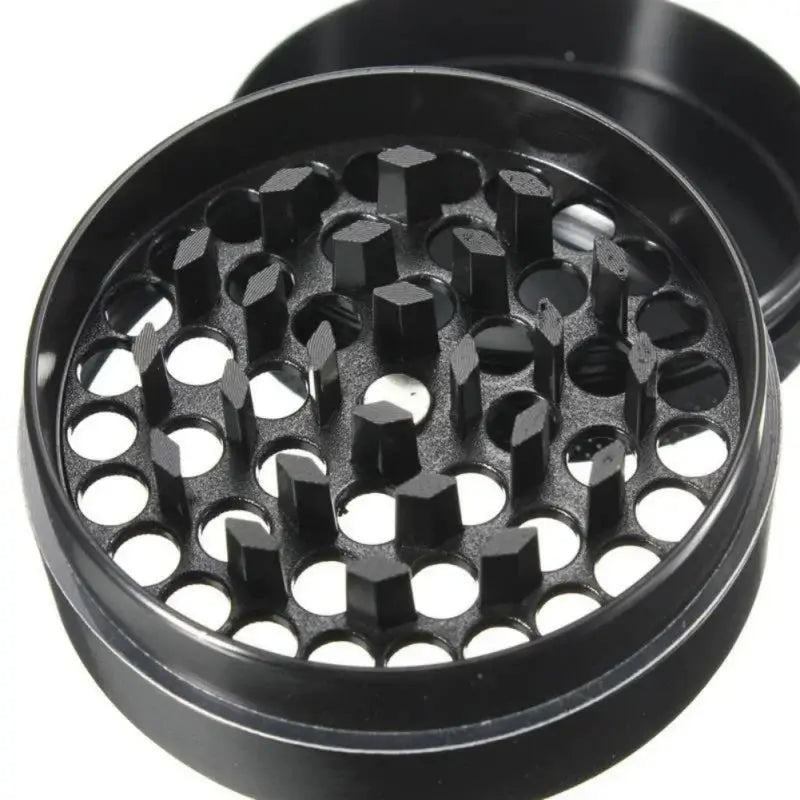 4-layer zinc alloy black herbal tobacco grinder with sharp teeth.