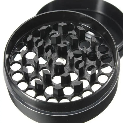 4-layer zinc alloy black herbal tobacco grinder with sharp teeth.