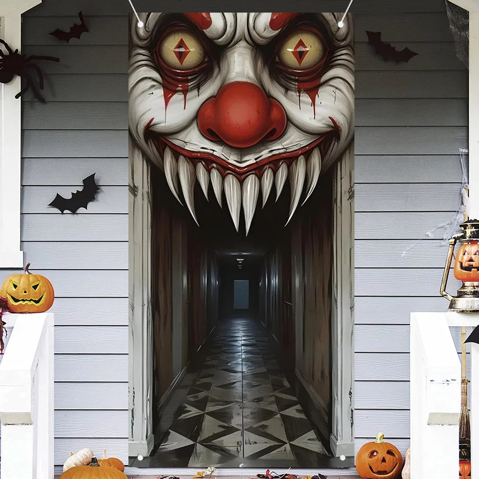 Scary clown face Halloween door cover decoration with bats and pumpkins for haunted house theme