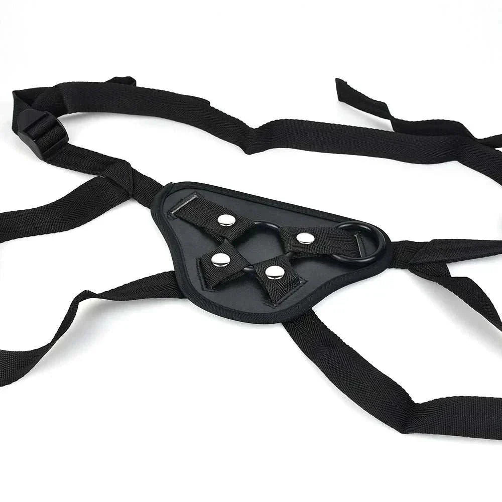 Adjustable leather strap-on harness with metal rings, designed for versatile use and comfort in bondage play.