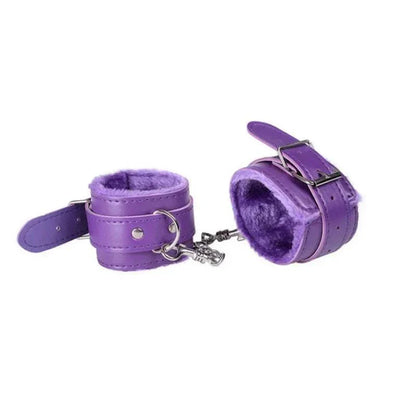 Purple soft plush BDSM handcuffs for adult bondage and restraint games.
