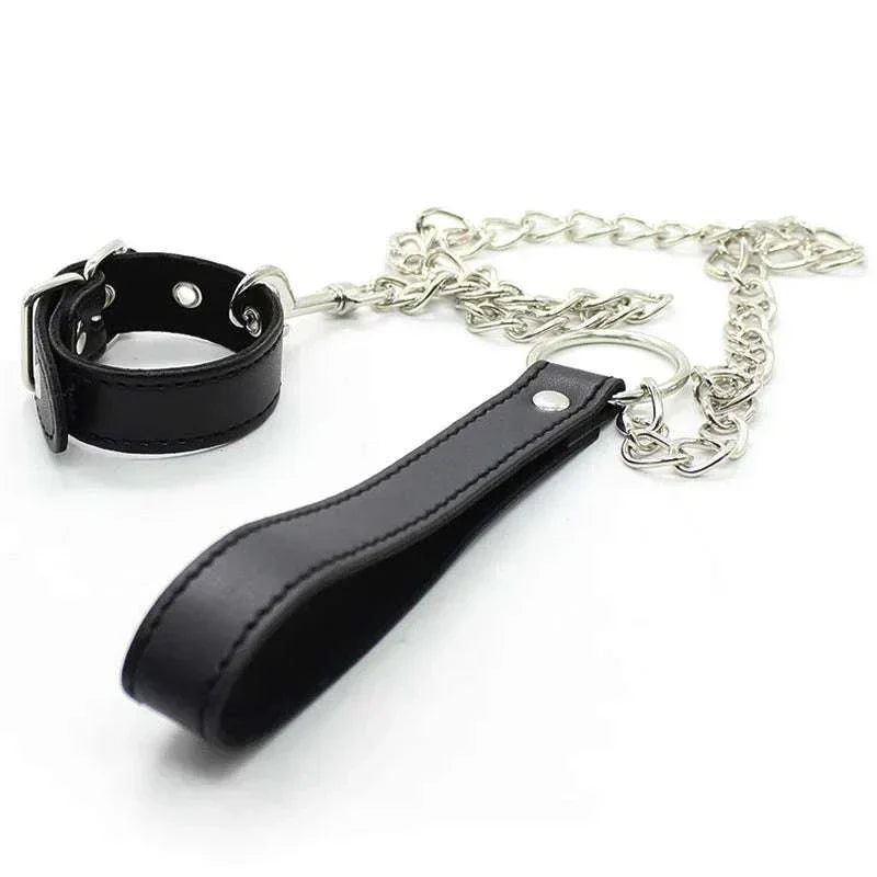 Leather penis ring with metal chain and scrotal cuff for BDSM training.
