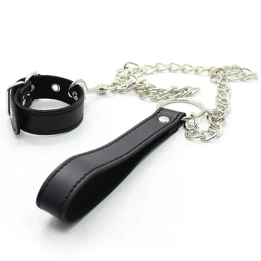 Leather penis ring with metal chain and scrotal cuff for BDSM training.