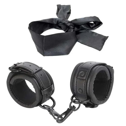 SM erotic leather handcuffs and footcuffs set for bondage and BDSM play.