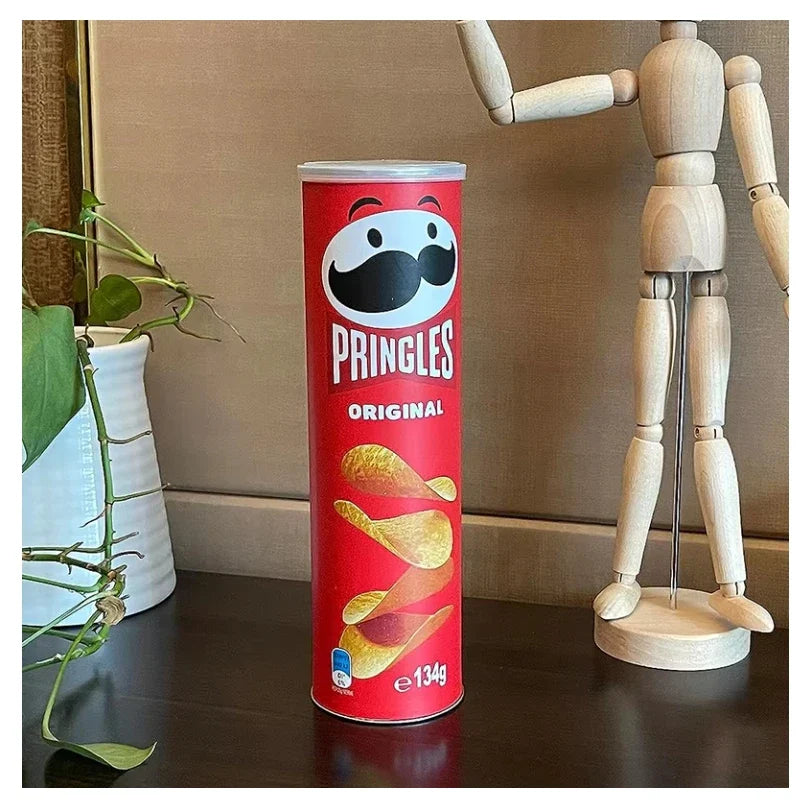 Tortilla flavoured corn chips diversion safe stash box disguised as a Pringles can on a table with decorative items.