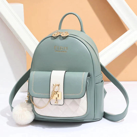 Stylish green backpack purse for women with pompom and front inner pocket faux leather design