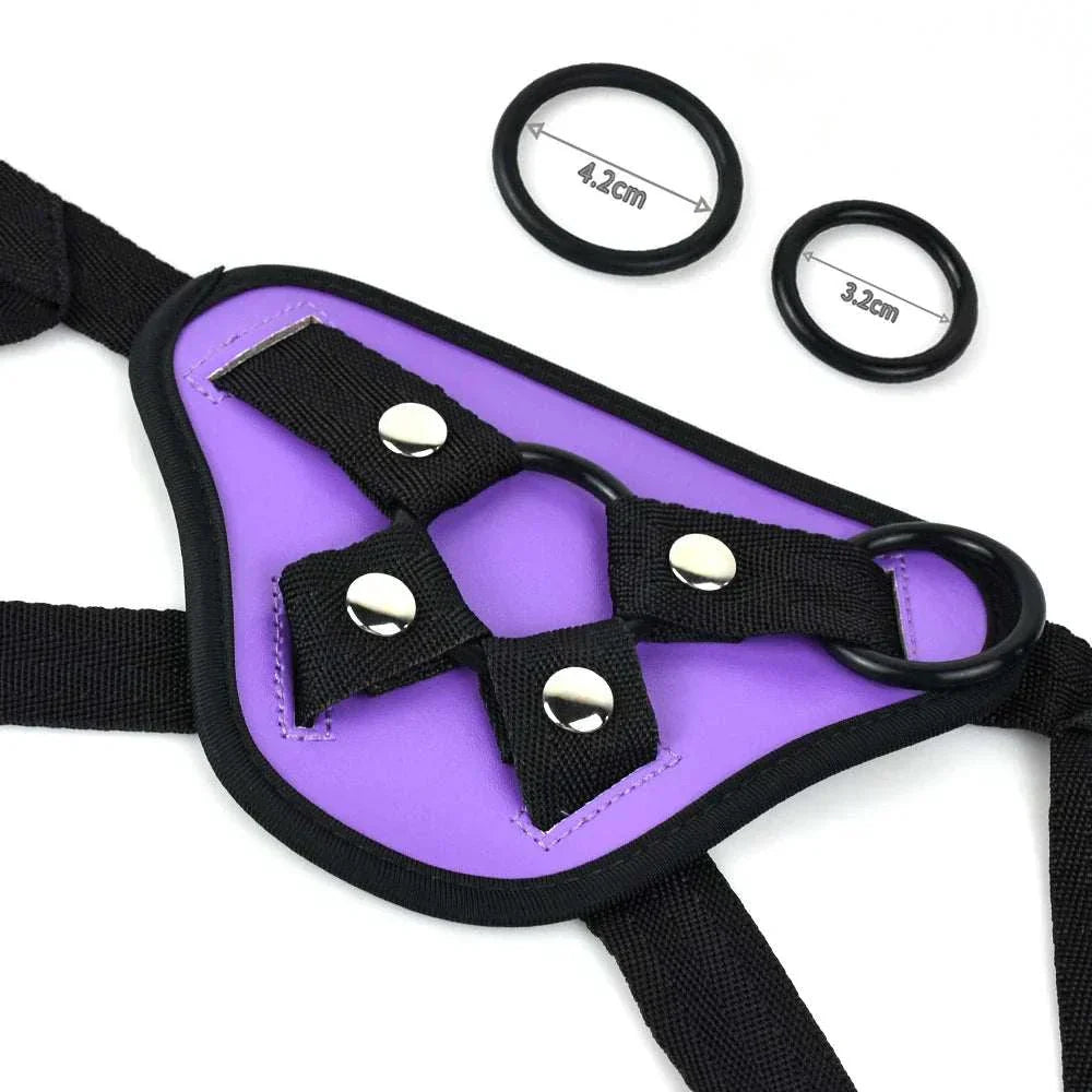 Purple adjustable bondage harness with two attachment rings for strap-on use.
