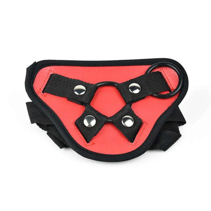 Red and black adjustable BDSM strap-on harness for adult use.