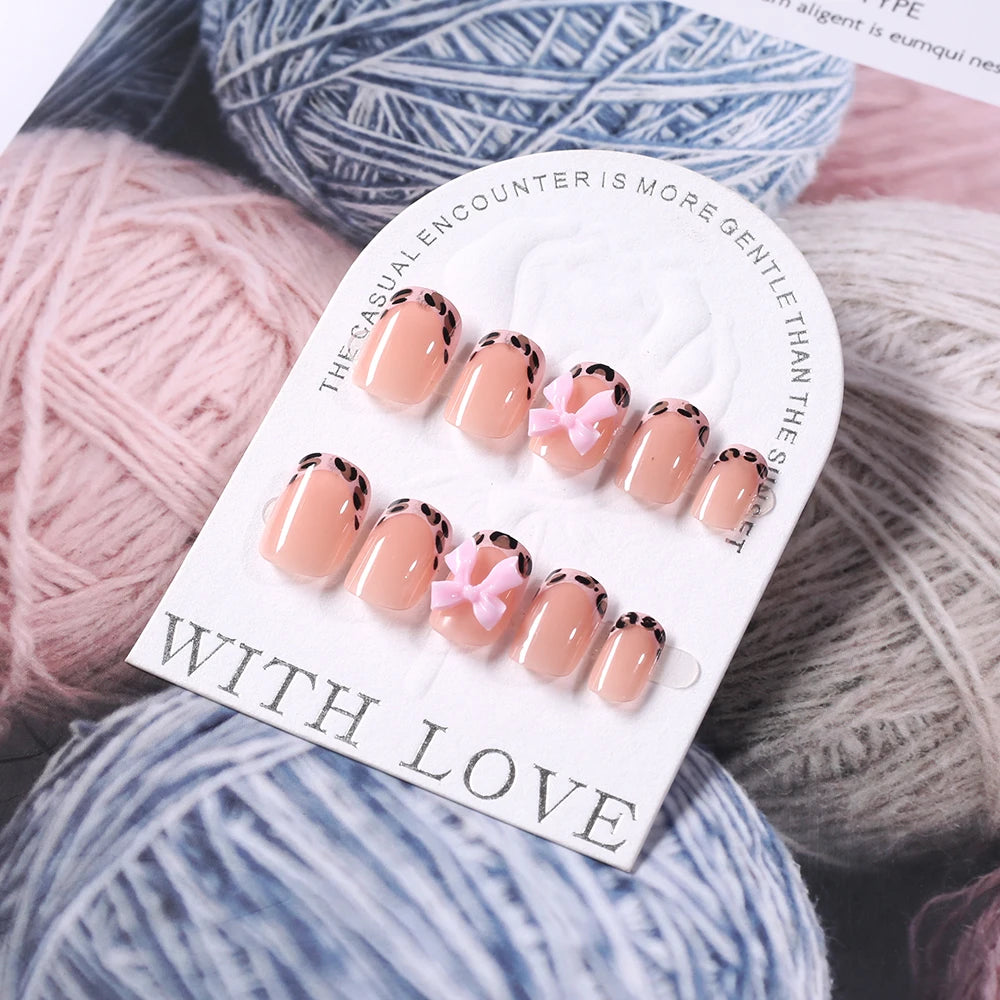 24Pcs Pink Leopard Print French Tips False Nails Short Square Head 3D Black Bowknot Fake Nails Acrylic Full Cover Press on Nails Good Vibrations