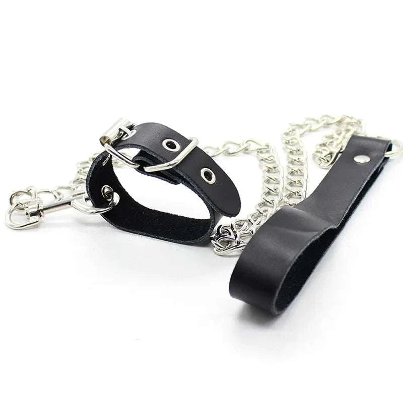 Leather penis ring with metal chain and scrotal cuff for BDSM training.