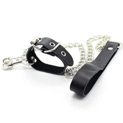 Leather penis ring with metal chain and scrotal cuff for BDSM training.