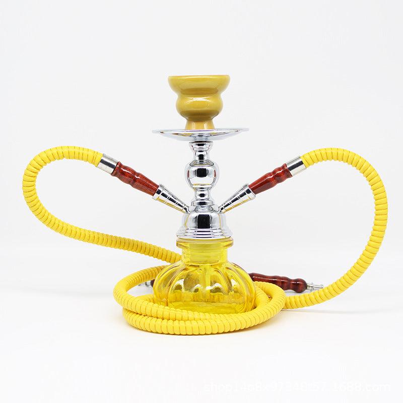 Small glass shisha pipe with yellow hose and silver bowl.