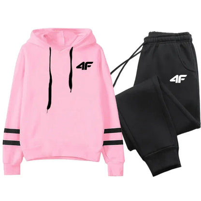 Women's tracksuit hoodies set with pink pullover hoodie and black sweatpants featuring stripe design and 4F logo for casual sportswear