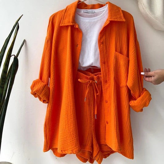 Orange solid color casual loose short pants set for women with a white inner top