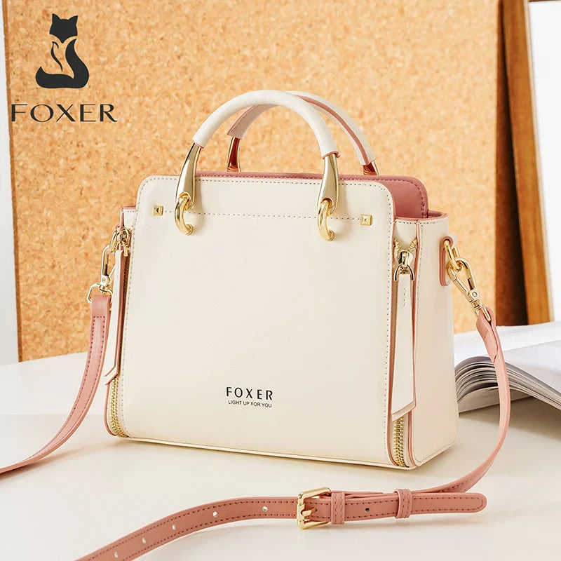 Elegant FOXER split leather shoulder bag for women with large capacity, soft material, multiple compartments, and versatile tote style in cream and blush pink.