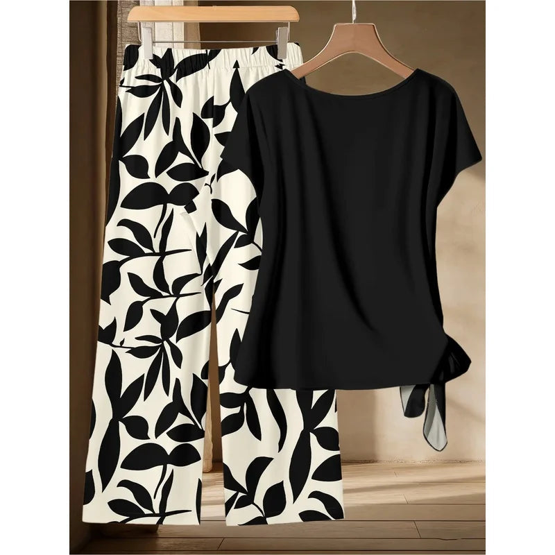 Women's plus Size Two-Piece Set Lazy Style Black Side Twisted T-Shirt And Black White Leaf Print Wide Leg Pants Casual Outfit Good Vibrations