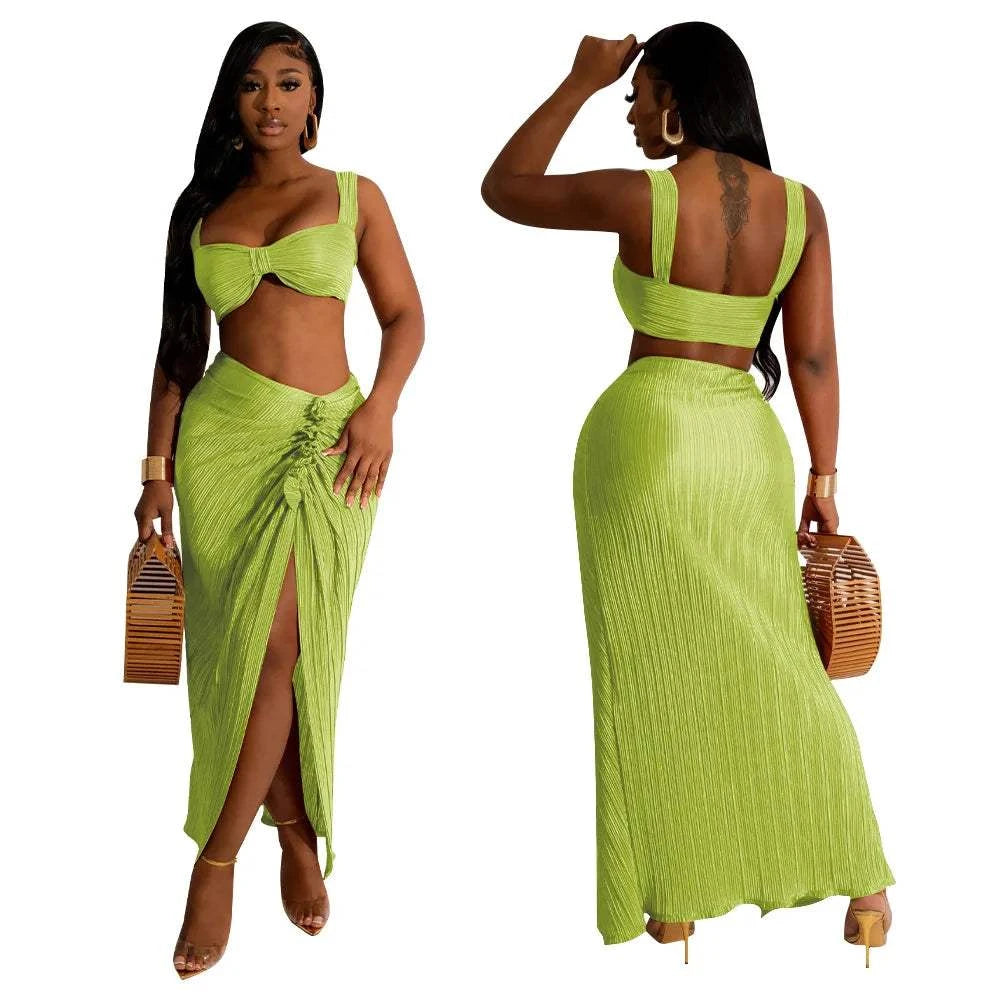 Summer two-piece set with sexy backless halter top and high waist side slit pleated skirt, ideal for beach streetwear.