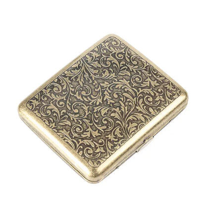 Retro brass cigarette box with intricate frosted design.