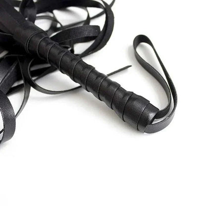 BDSM leather whip for adults' erotic games and bondage activities.