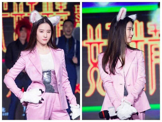 Young woman wearing Escape Cute Princess cat ear hairpin and pink suit on stage
