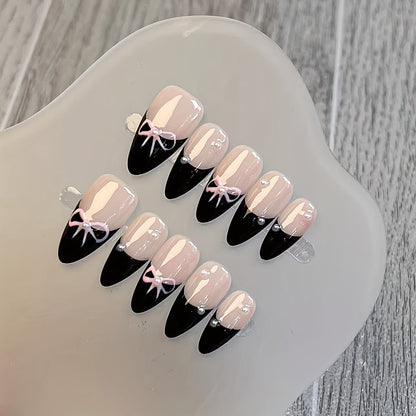 10 Pcs Hand-Painted Bow Tie Decorated French Manicure Press-On Nail Tips with Pearl Accents - Black and Pink Color Scheme, Almond Shape, Medium Length Good Vibrations