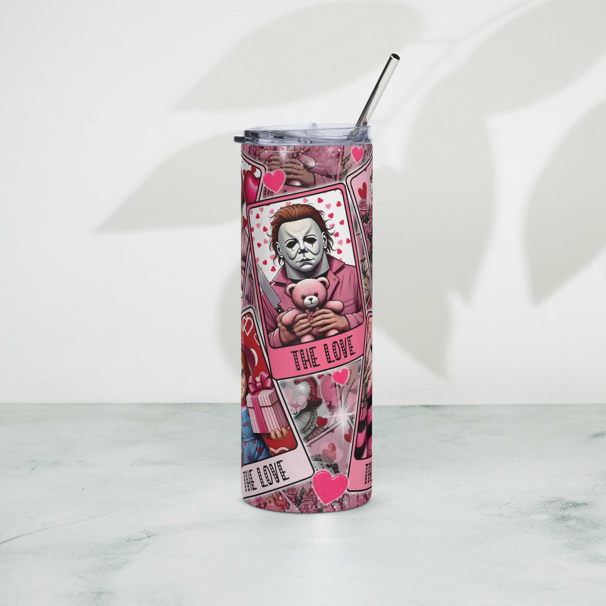 Stainless steel tumbler with artistic design, lid, and metal straw.