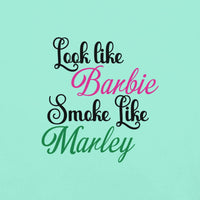 Mint green t-shirt with "Look like Barbie, Smoke like Marley" print in stylish fonts.