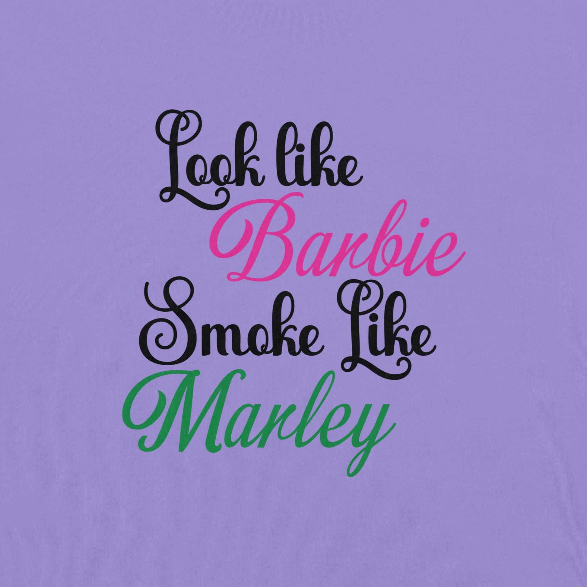 "Barbie Marley unisex heavyweight t-shirt with text 'Look like Barbie, Smoke like Marley' in bold font on a purple background."