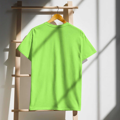 Green DryBlend® T-Shirt hanging on wooden rack in sunlight, back view.