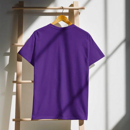Purple Saggin Still Gaggin DryBlend T-Shirt on hanger with sunlight shadows.