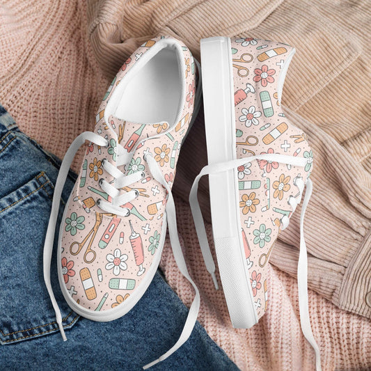 Women’s lace-up canvas shoes with pastel medical-themed print and white soles and laces